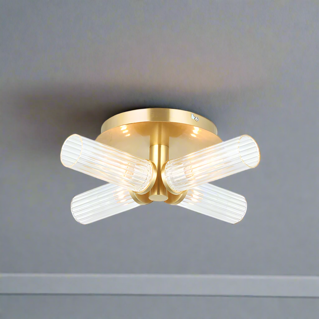 Four light semi-flush style; stunning brushed gold and clear ribbed glass light.
It has an IP44 rate, suitable for a&nbsp; bathroom use. Make your bathroom glamorous! Can also be used as a wall light.
