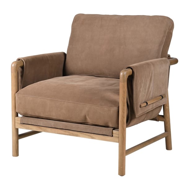 A statement suede armchair with long toggle accent feature to the reverse and over the wooden arms. An outstanding chair in a delicious suede leather caramel colour .&nbsp; The sturdy oak frame is covered in the same suede fabric with the addition of a decorative oak toggle holding the fabric securely. The reverse of the chair has he same suede covering and toggle set behind the supporting back cushion. Exceptional, design and comfort in a classic piece of furniture.&nbsp; That would work in any interior, c