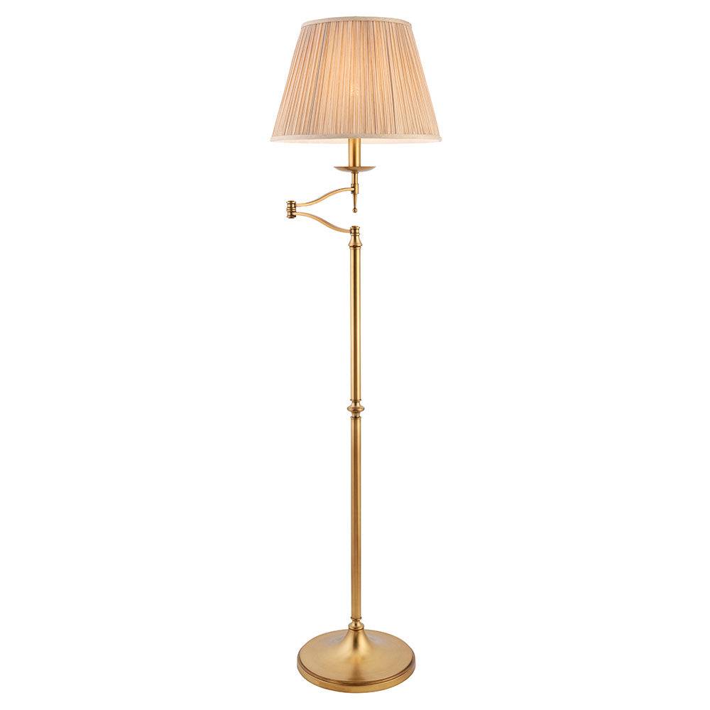 Antique brass floor lamp with adjustable swing arm and beige fabric shade, elegant home lighting for living room or study