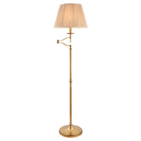 Antique brass floor lamp with adjustable swing arm and beige fabric shade, elegant home lighting for living room or study