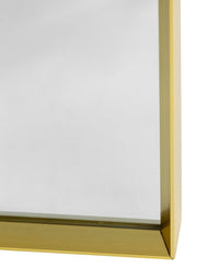 Metal framed arched mirror with a slim frame detail