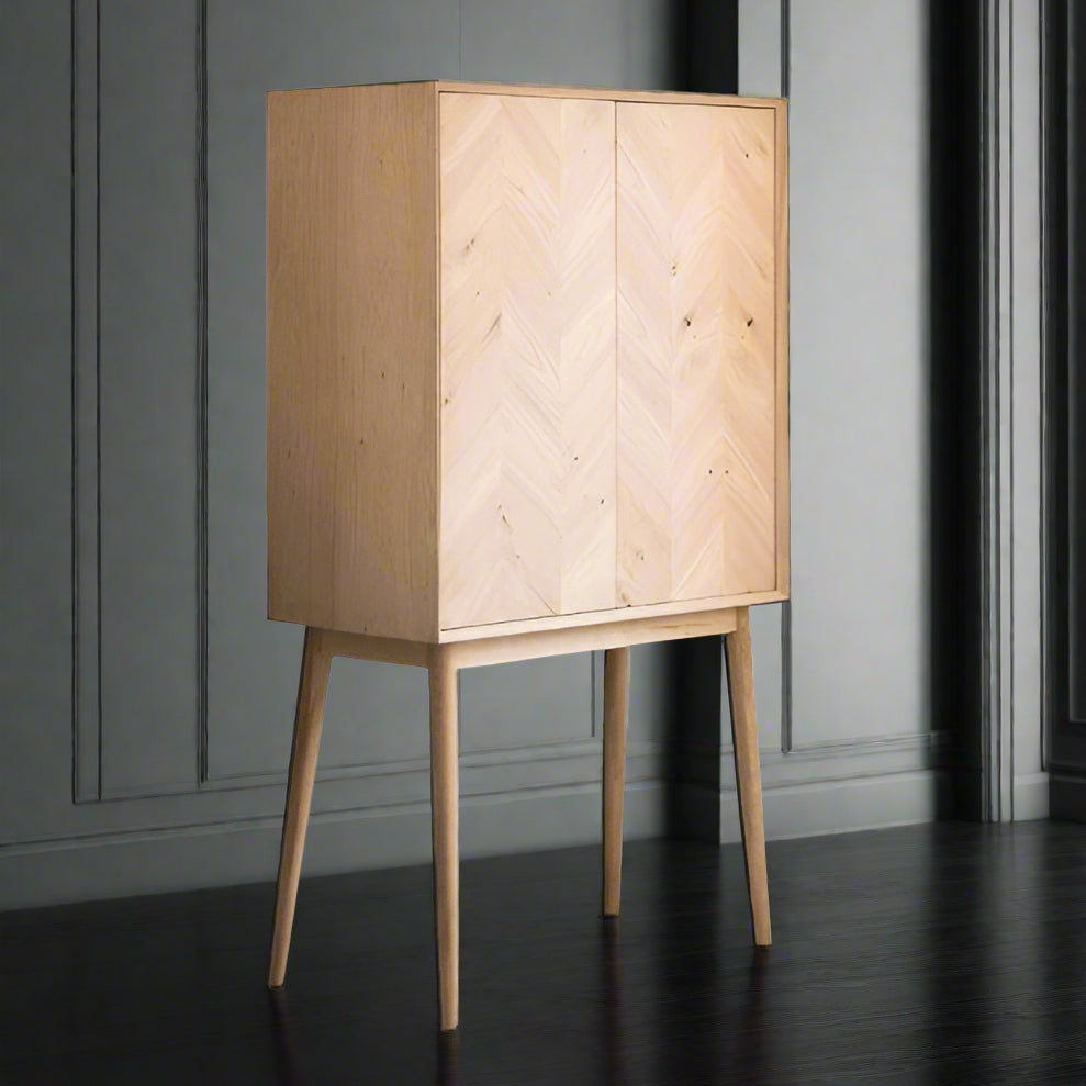 Tall natural oak veneered cocktail cabinet with 2 internal glass shelves and internal mirrored back.