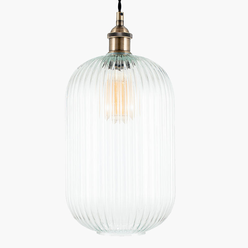 Tall, clear, ribbed glass pendant with brass fittings. A tall glass pendant for the hall, stairwell or in a pair over a kitchen island