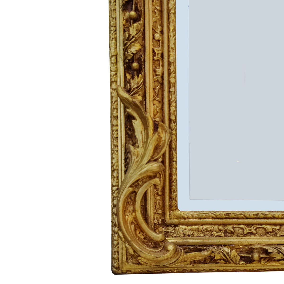 Ornate gilt wood mirror, with carved frame and topped with a pair of cherubs holding a medallion.&nbsp; Highly decorative mirror in the 'Georgian' style, perfect in a hall, over a fireplace in a living room or as a stunning addition to your bedroom or dressing room.&nbsp; These mirrors work well in a period country home as well as adding that luxurious touch to a town home.&nbsp;

H: 180 cm W: 100 cm D: 16 cm