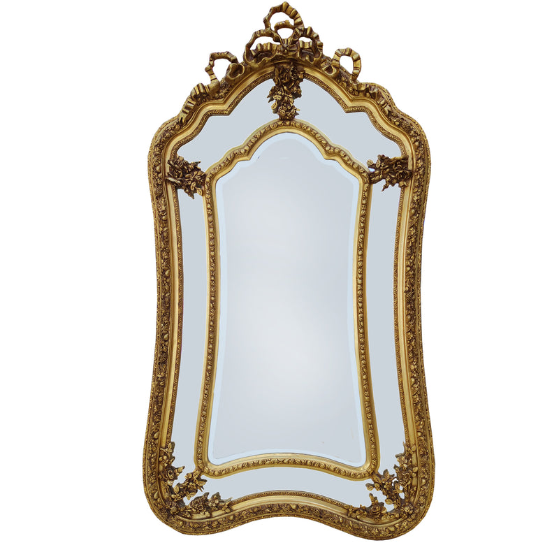 A highly decorative Rococo style mirror with beveled glass panels to the sides and decorative curve to the base.&nbsp; The top is adorned with elaborate bow and ribbon motifs and floral embellishments, typical of the neoclassical 'Georgian' style,&nbsp; The inner panels follow a similar scallop shape to mirror the outer frame.&nbsp; Exceptionally ornate mirror which would loom amazing in a country house interior or in a period town home. In a hall, living room or bedroom it will take centre stage and add li