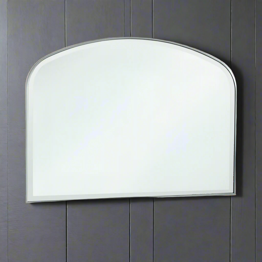 Slim framed overmantle mirror in silver. A minimalist mirror in a typical overmantle shape, in a contemporary setting this mirror could sit over a fireplace or console table.   Examples of oermantes are available to see in our Chiswick West London store.