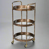 A gilt drinks trolley withe three mirrored trays, that can be used independently to the trolley.&nbsp; The trays are mirrored glass with a tranquil waterside scene in gilt,&nbsp; the frame of the trolley is brushed gilt metal and the whole thing is set on four castors.&nbsp; Trolley such as these are called 'drinks' trolleys, but can also be used to display all your toiletries in a bathroom, to display plants in a conservatory, they have diverse uses.&nbsp; Not forgetting three useful trays.