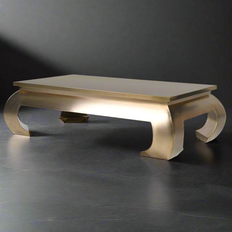 An extraordinary metal coffee table, the ultimate in glamorous furniture. Large enough to make a real statement in a room. This extra large gilt metal table is 140 cm wide and 80 cm deep so will make an enormous impact.&nbsp; &nbsp;Sleek, gilt metallic with exquisite , bold curved legs.&nbsp; It is Asian inspired modern glamour, an absolute stand out piece that would need to be in an ultra stylish area.&nbsp; It is almost a sculptural work of art but it is definitely also functional and needs to be used.&nb