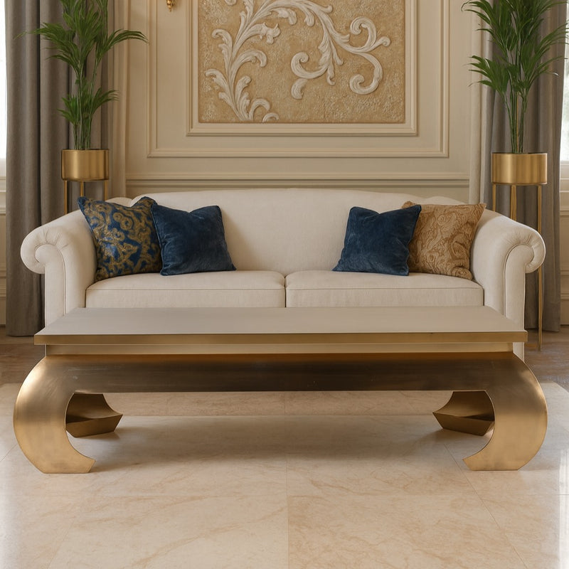 An extraordinary metal coffee table, the ultimate in glamorous furniture. Large enough to make a real statement in a room. This extra large gilt metal table is 140 cm wide and 80 cm deep so will make an enormous impact.&nbsp; &nbsp;Sleek, gilt metallic with exquisite , bold curved legs.&nbsp; It is Asian inspired modern glamour, an absolute stand out piece that would need to be in an ultra stylish area.&nbsp; It is almost a sculptural work of art but it is definitely also functional and needs to be used.