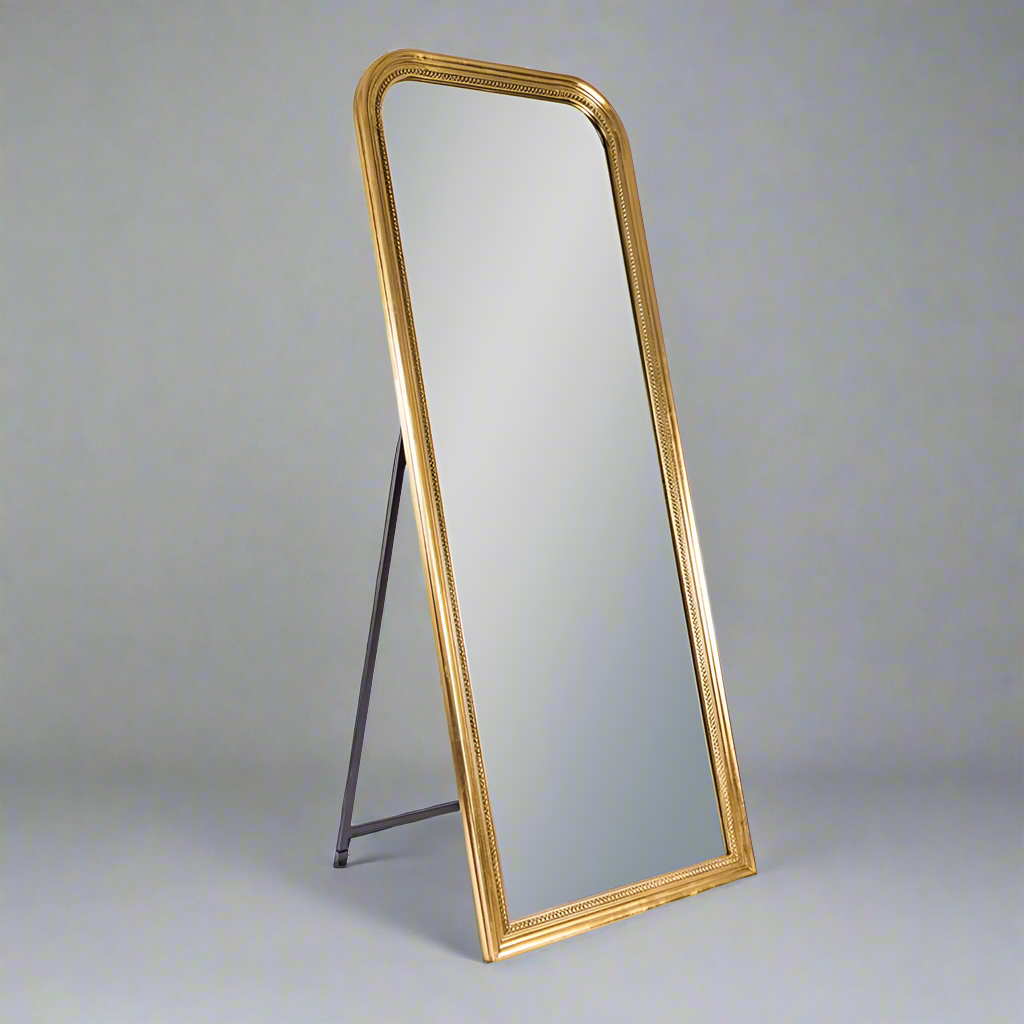 A tall gold framed beaded full length dressing mirror, perfect leant against the wall or pull out the integrated stand to see your full reflection before you leave the house. A perfect bedroom or dressing room mirror.