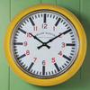 Bright yellow 'English Electric' metal kitchen clock, this clock has a particularly deep frame so projects from the wall 12 cm, which just adds to the retro and vintage feel. 
