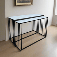 Marble topped console tables on a black iron metal base. These sturdy pieces where the white marble contrasts stunningly against simple black iron legs. 
