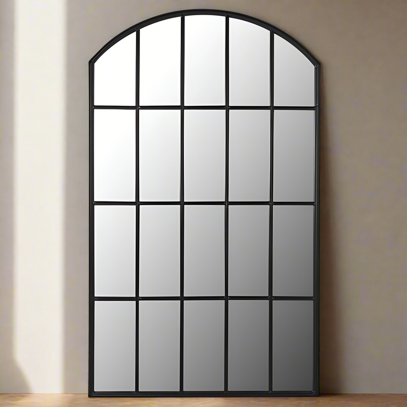 Tall and wide black arched window panelled mirror. With this mirror on any wall you can add light and perspective to any room, a great way to fool the eye that a hall goes a lot further than it does.