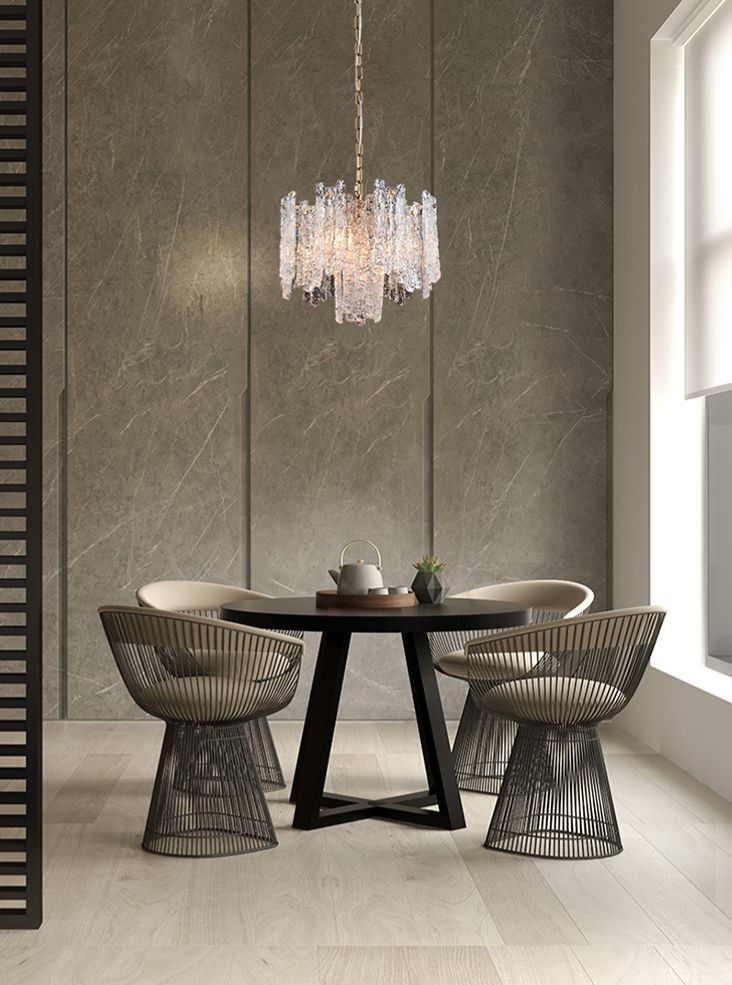 Icicle shard chandelier with textured glass panels at varying heights to refract the lights. It has 5 lights and aged brushed brass metal fittings. Perfect sitting room chandelier, a glamorous, statement light.