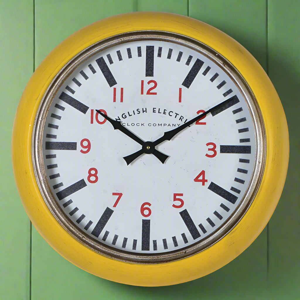 Yellow retro wall clock with a metal frame and vintage English Electric dial featuring red numerals and bold black markings, ideal for kitchen or home décor.