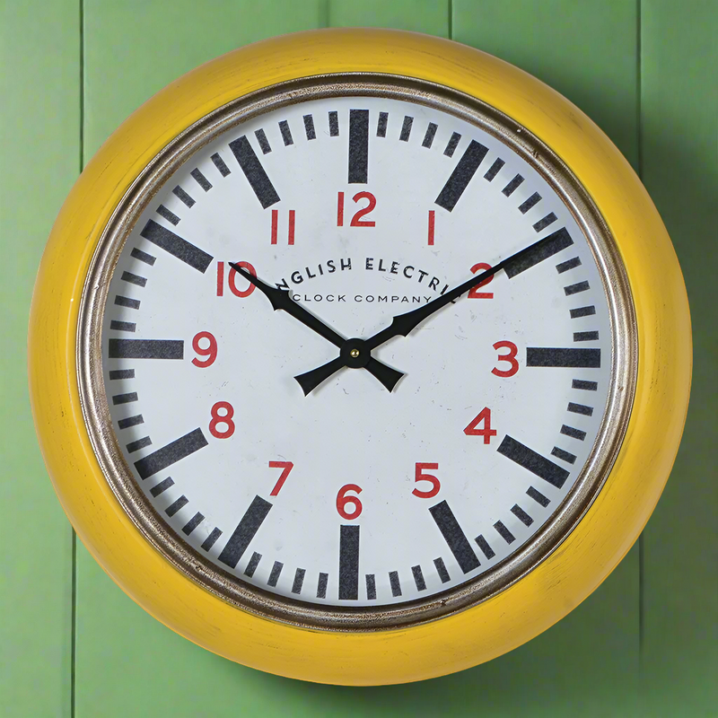 Yellow retro wall clock with a metal frame and vintage English Electric dial featuring red numerals and bold black markings, ideal for kitchen or home décor.