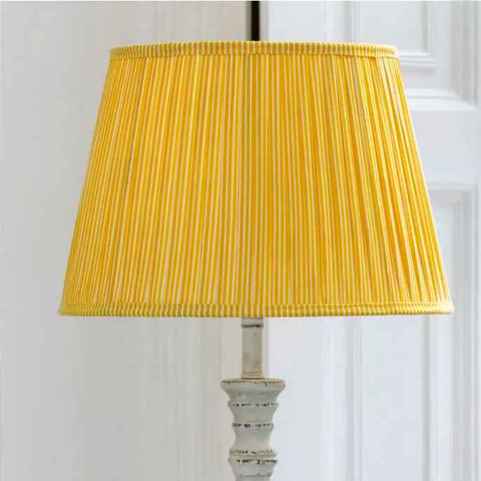 Striped yellow & white cotton shade.This lampshade is perfectly suited for most small to medium lamp bases, making it a versatile choice for living rooms or bedrooms. 