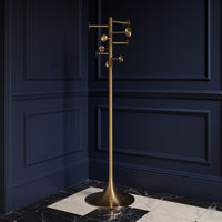 Tall aged brass coat stand with nine sculptural hooks and a ribbed column on a circular weighted base.