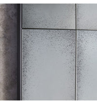 Close-up of the aged glass grid panels on the window mirror