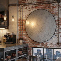 Hanging in an urban style kitchen, with industrial lights and metal surfaces, on a brick and plaster wall.