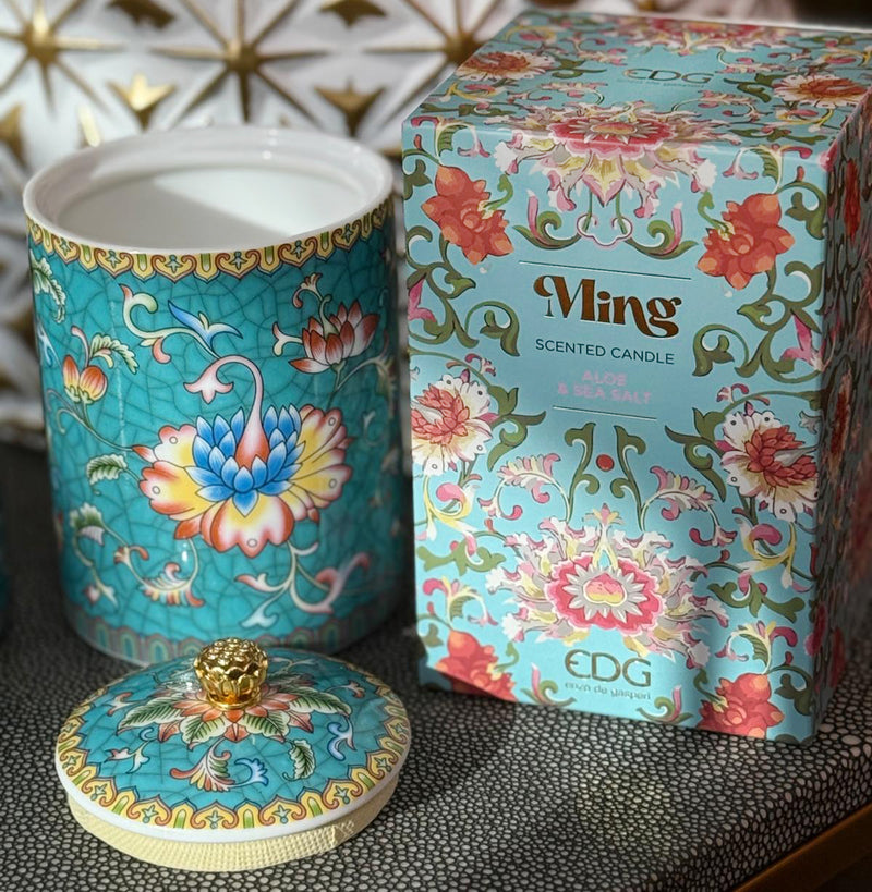 Handcrafted ceramic candle jar with turquoise floral design and gold detailing, scented with Aloe and Sea Salt.