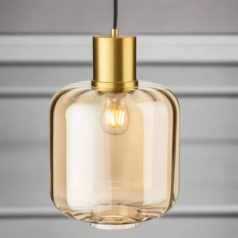 Large amber glass pendant light with brushed gold metal top, a muted colour to add a glow to your room, perfect as a kitchen island light. This particular pendant is available to view in the Chiswick Store. Glass pendant lighting is perfect for use in kitchens.