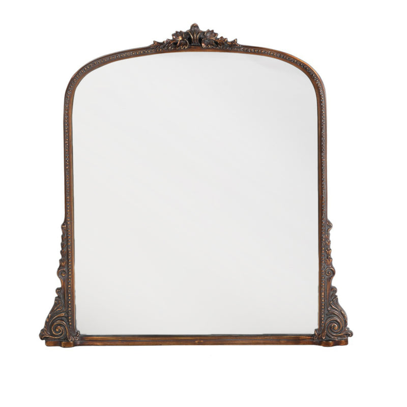 Antique-style overmantle mirror with ornate bronze-finished frame and decorative carved detailing.