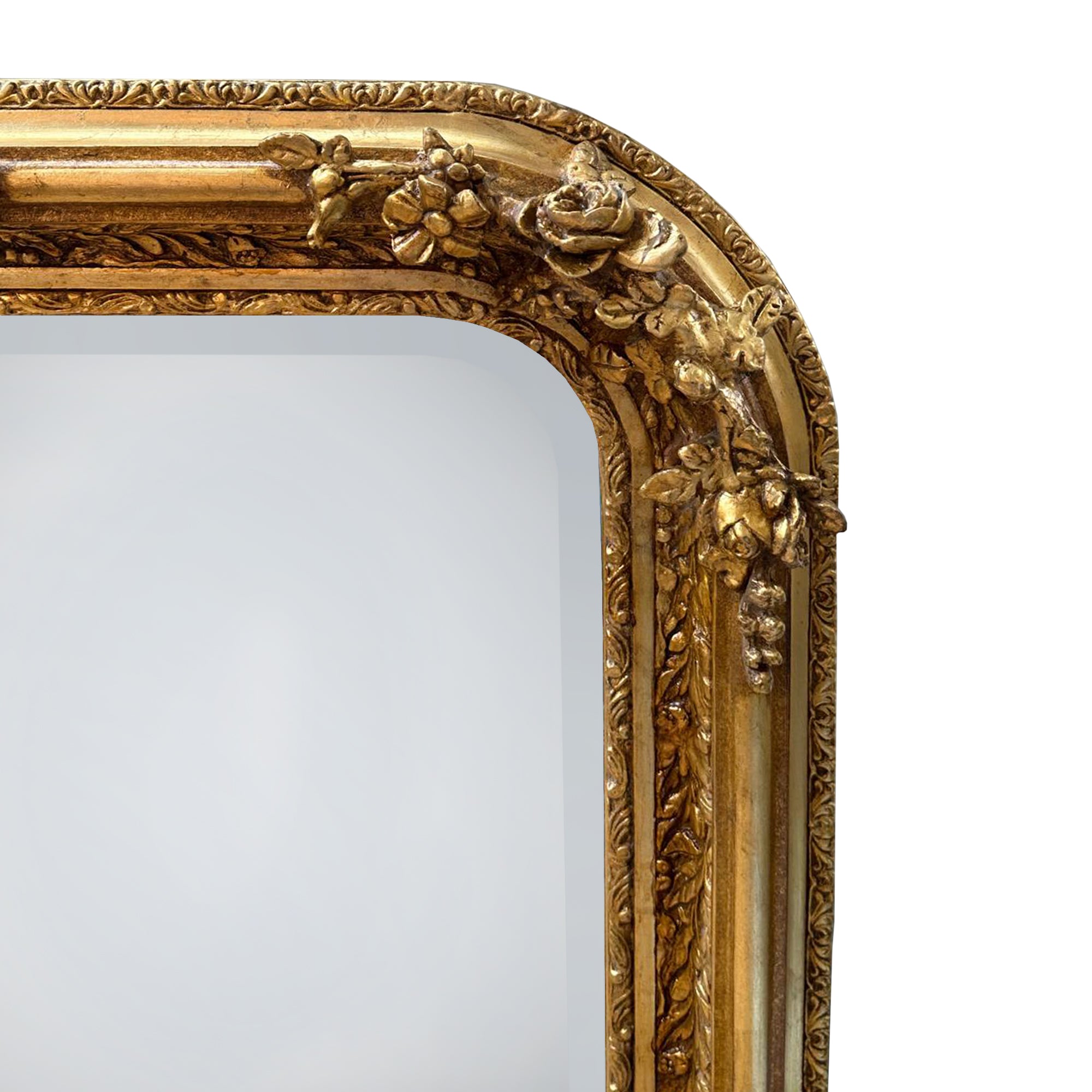 Make a grand statement with this exquisite Large Ornate Gold Overmantle Mirror, a luxurious piece designed to bring timeless elegance and opulence to your interior.

Crafted with intricate detail, the mirror features a richly carved frame adorned with floral garlands, scrollwork, and a central crest displaying classical motifs — evoking the romantic grandeur of the Louis XVI era. The generous rectangular shape, softened by elegantly curved corners, offers both functionality and decorative impact.

Over a fi