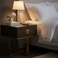 Beautifully designed bedside table in an ash veneer with antique gold accents. A great side table with a contemporary aesthetic, would work well as an occasional table in your living room