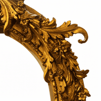 Ornate gilt framed mirror-detail.