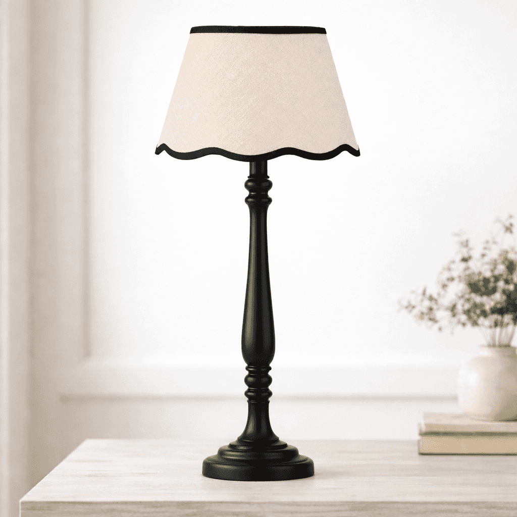 Table lamp with a white shade on a wooden surface, blurred background
