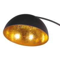 Black and gold lamp with a white background - close up of gilt inner