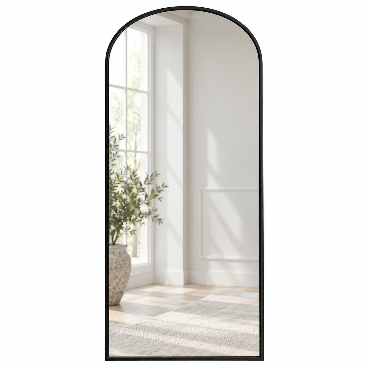 Simple black arched mirror in a white room.