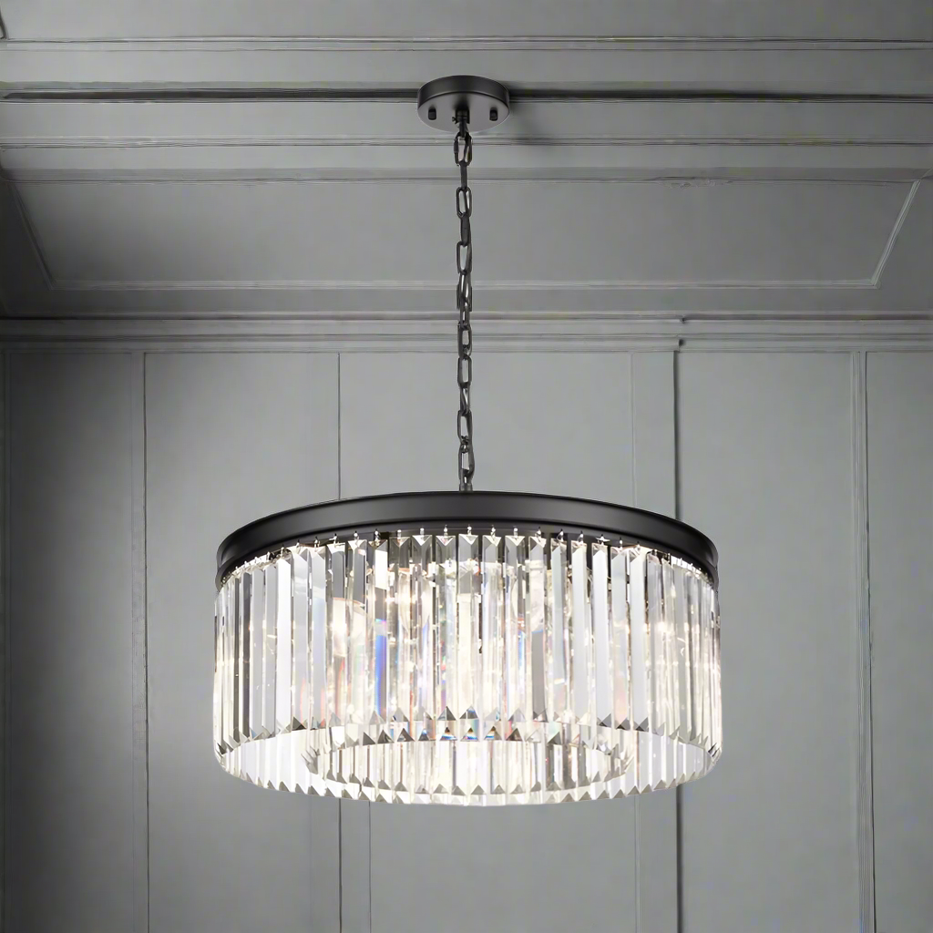 Black metal crystal prism chandelier, a halo of light that works whatever ceiling height you have, a new take on the classic chandelier. This is the perfect size for a sitting room, over a dining table to give your space a high end luxurious look.
