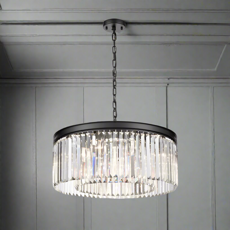 Black metal crystal prism chandelier, a halo of light that works whatever ceiling height you have, a new take on the classic chandelier. This is the perfect size for a sitting room, over a dining table to give your space a high end luxurious look.