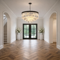 Luxurious interior with a chandelier, arched doorways, and a staircase.