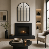 Modern living room with a fireplace, mirror, and decor items.
