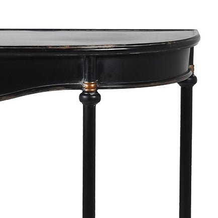 Refined, versatile, and effortlessly elegant, this medium metal console table is the perfect accent piece for modern and traditional interiors alike. Designed with a slim black metal frame and a gracefully curved silhouette, it offers a sophisticated focal point while keeping your hallway or entryway light and uncluttered.
The gently distressed black finish with delicate gold accents adds a touch of vintage character, making each piece feel unique.