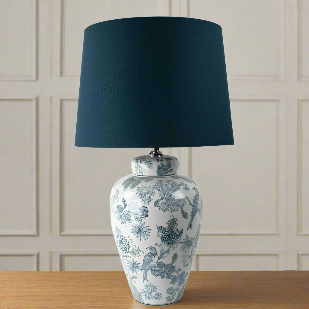 Tall, elegant ceramic lamp with a distinctive large blue lampshade. The base decorated with pale blue and white exotic birds. Would work so well in any interiors, perfect  living room table lamp.