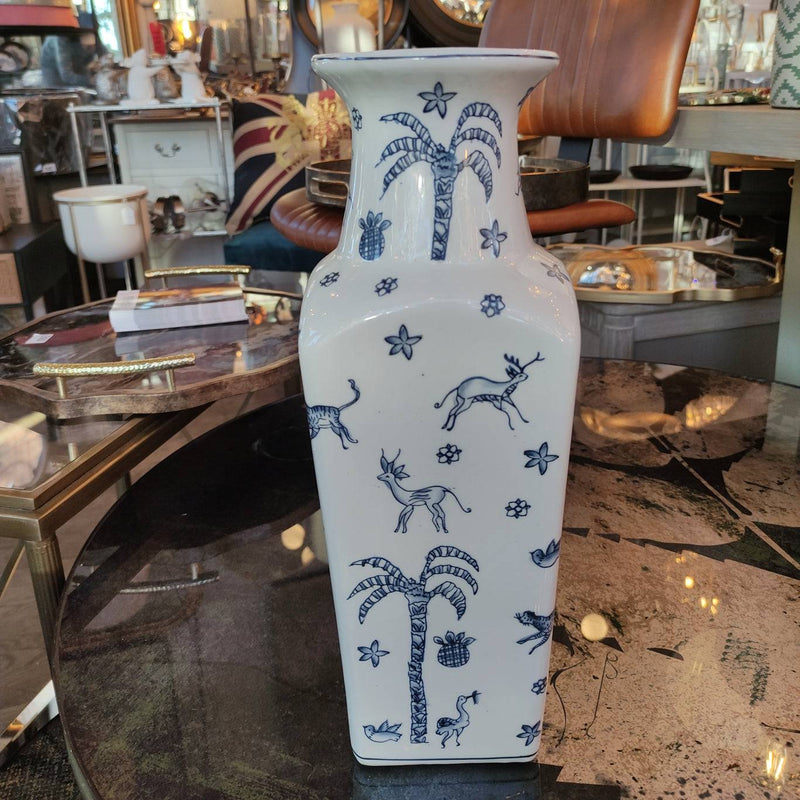 Blue and white ceramic vase,  Its  shape with a flared neck gives it a distinctive and elegant appearance, versatile for both traditional and contemporary interiors.