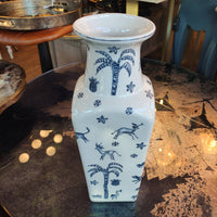 Blue and white ceramic vase,  Its  shape with a flared neck gives it a distinctive and elegant appearance, versatile for both traditional and contemporary interiors.