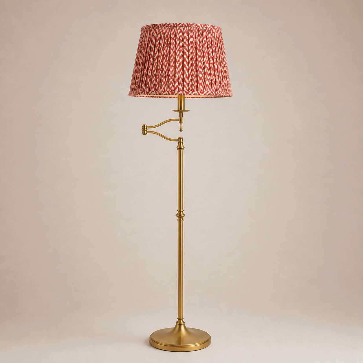 Floor lamp with a red textured shade on a beige background