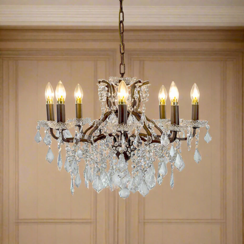 Bronze shallow 8-arm crystal chandelier with faceted crystal droplets in a living room