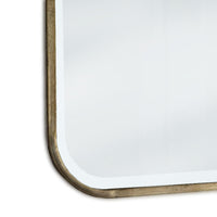 Curved corner and bronze metal frame detail on mirror