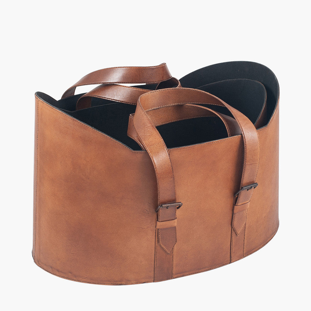 Pair of leather storage baskets on  a white background.