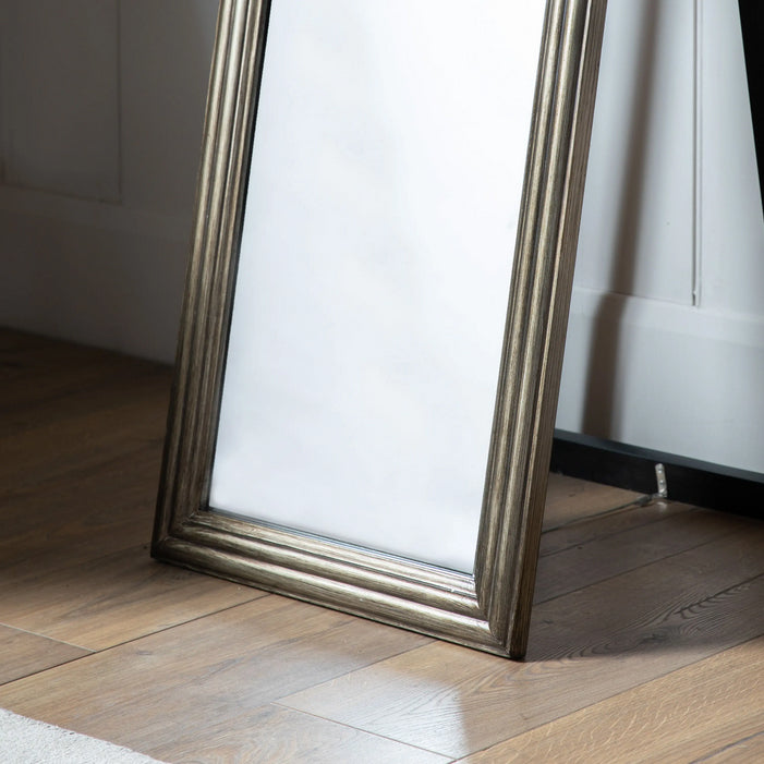 Free-standing stand of brushed brass cheval mirror