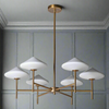 A chandelier with white glass shades and a gold metal base, designed to be suspended from the ceiling.