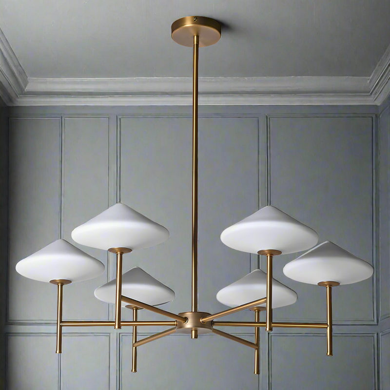 A chandelier with white glass shades and a gold metal base, designed to be suspended from the ceiling.