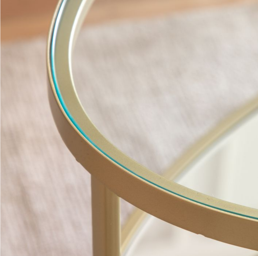Champagne gold metal frame on oval coffee table