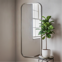 Champagne gold full length mirror in a living room